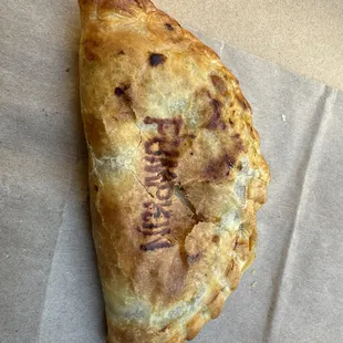 Freshly warmed pumpkin empanada