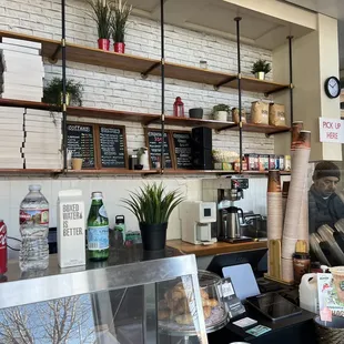 the counter and shelves of a coffee shop