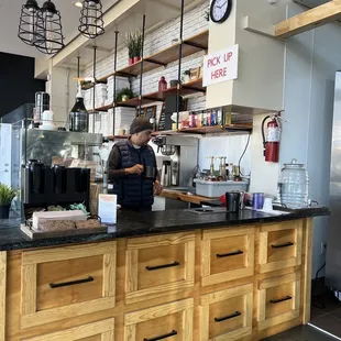 a bari preparing a cup of coffee