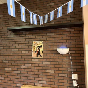 a brick wall with a picture of a man on it