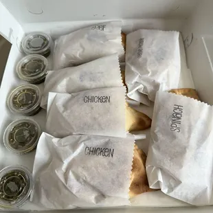 Assortment of empanadas with chimichurri sauce