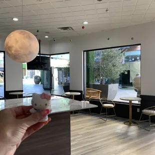 a hand holding a cup of coffee