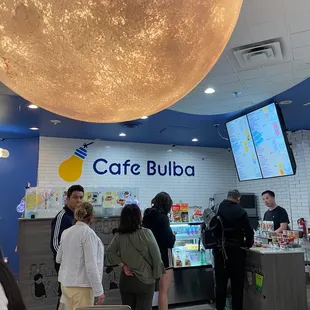 people standing in line at the counter