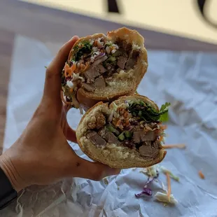 9/11/21 - $12 Crispy Pork Bahn mi. Nice cross section with large cuts of duck meat.