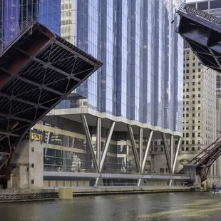 a boat passing under a bridge