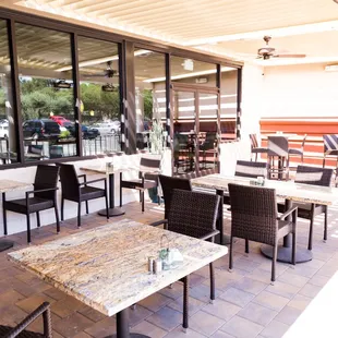 tables and chairs outside a restaurant