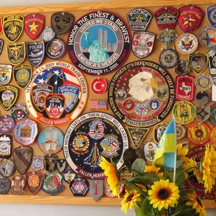 a vase of sunflowers and patches