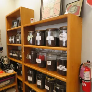 a shelf full of jars of food