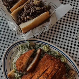 Cheesesteak, Caesar salad with chicken cutlet