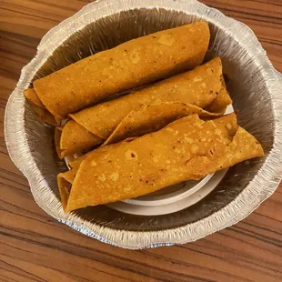 Flautas (comes with guacamole and sour cream on side) when doing take out.