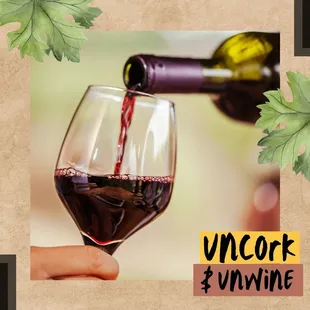 a person pouring wine into a glass