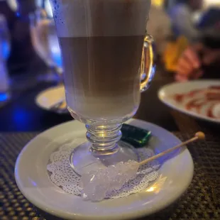 a cup of coffee on a plate