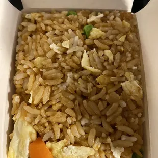rice and vegetables in a takeout box