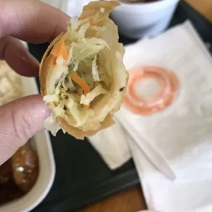 Inside of eggroll/spring roll. Minimal flavor, very stringy shredded cabbage. Odd black specs in everything but zero pepper flavor.
