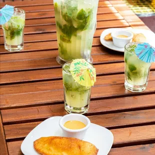 Enjpy our tropical pitchers and latin american dishes Mojito pirchers $30 6 to 8
