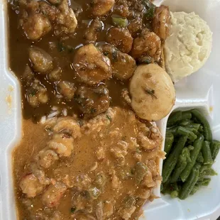 Crawfish etouffee, shrimp potato egg stew, potato salad and green beans