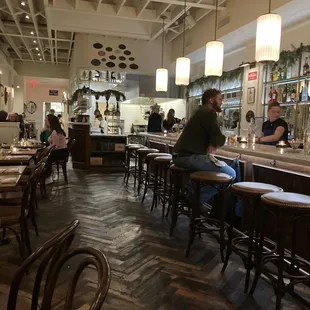 Long thin room with bar