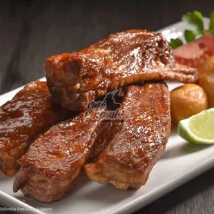 ribs and potatoes on a plate