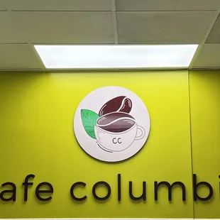 a cup of coffee on a sign