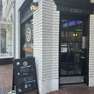 the entrance to a coffee shop