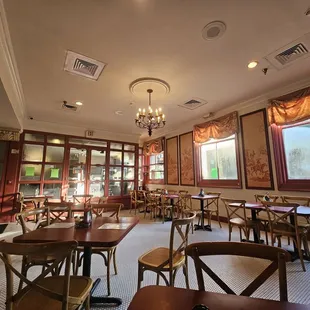 tables, chairs, and a chandelier