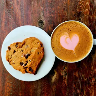 Gluten free vegan chocolate chip cookies with a flat white