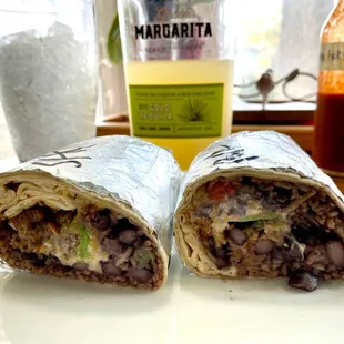 Burrito asada (left) Carnita (left) Carnita is the winner!