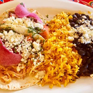 Chicken taco, Steak taco, rice and black beans with cheese.