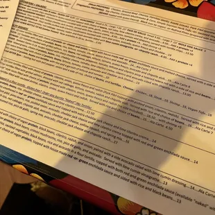 a menu and a glass of wine