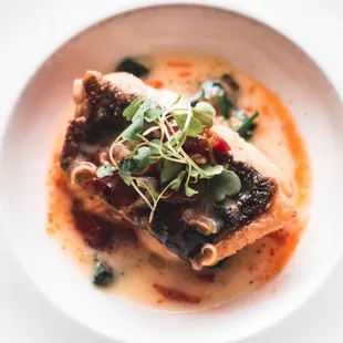 a plate of food on a white table
