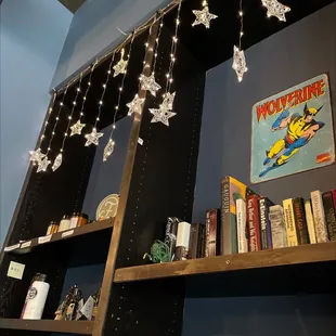 a bookshelf with books and decorations
