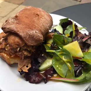 a sandwich and a salad on a plate