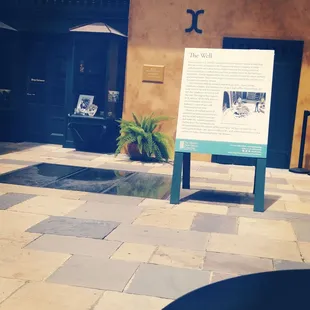 a sign in front of a building