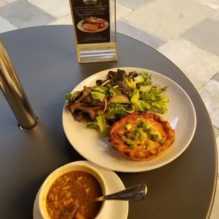 a plate of food and a bowl of soup