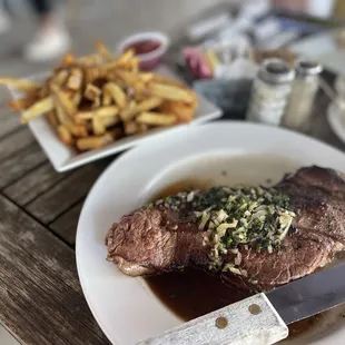 steak and french fries on a plate