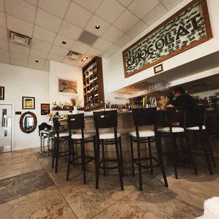 a bar with a lot of chairs