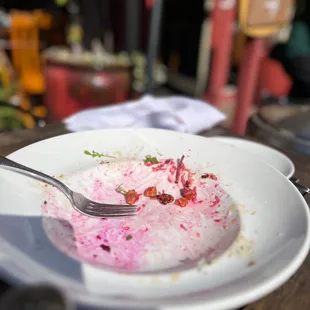 a plate of food left on a table