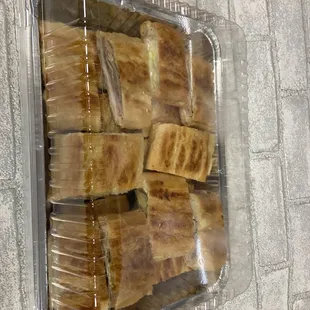 Tray of pressed Cuban Sandwiches cut in 4s