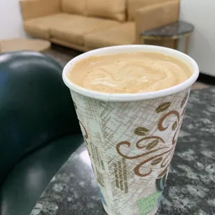 a cup of coffee on a table