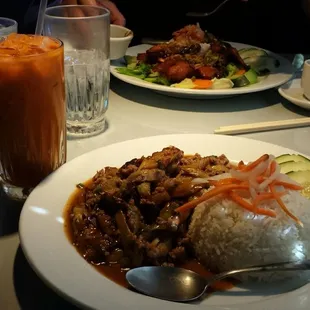 Crispy quail at the back, drinks, pork &amp; eggplant up front.