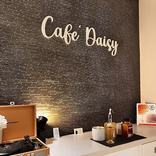 a coffee station with a coffee maker