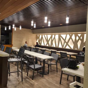 a restaurant with tables and chairs