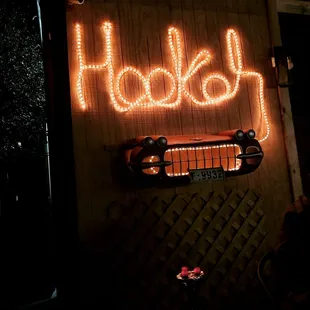 a neon sign that says holiday