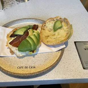 Cheese bread with fried egg, bacon and avocado