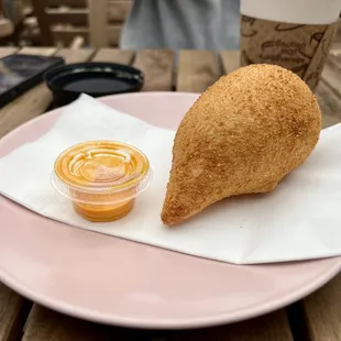 Coxinha - a Brazilian fried dumpling, stuffed with shredded chicken meat and cream cheese, shaped to look like a little chicken drumstick