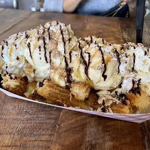 a waffle with ice cream and chocolate sauce