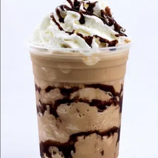 a milkshake with whipped cream and chocolate