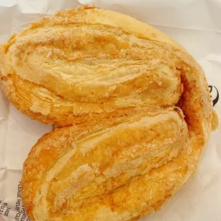 two pastries on a paper wrapper