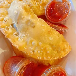 a plate of pastries and condiments