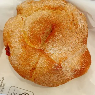a donut covered in sugar